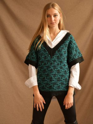 Double-sided turquoise oversize vest by Pasma Design, perfect for layering and adding a pop of color to any outfit. Made with high-quality materials and expert craftsmanship