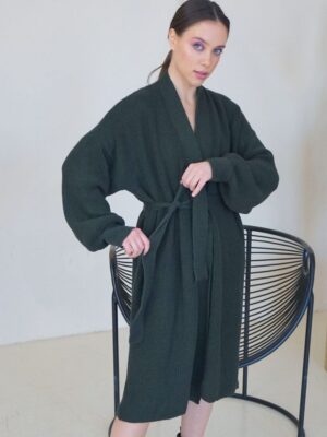 Dark Green Merino Knitted Cardigan - model front picture handling the belt