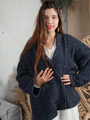 A stylish double-breasted blue jacket made of knitted fabric, available for purchase